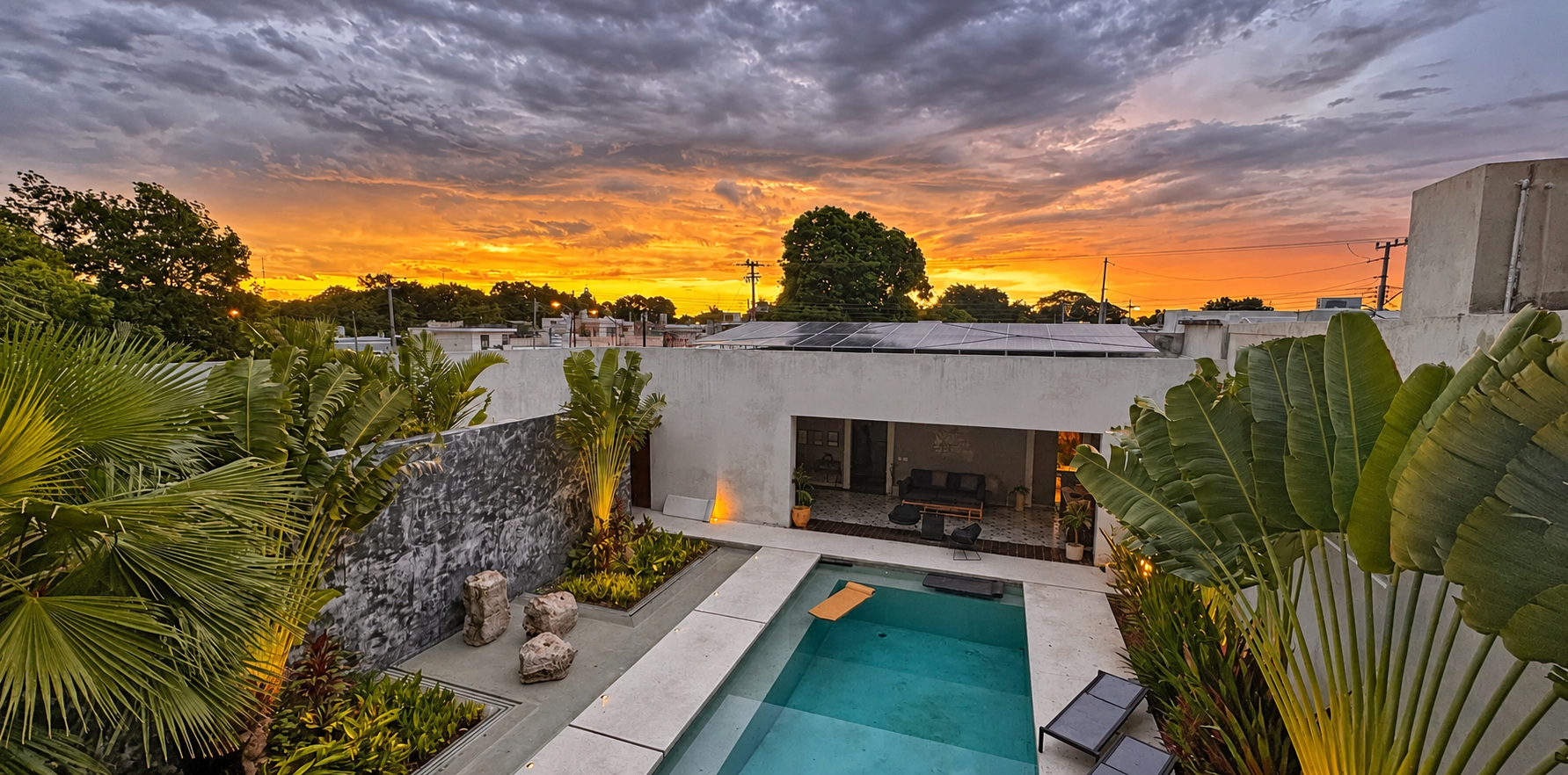 Principal-suite balcony · pool view at sunset