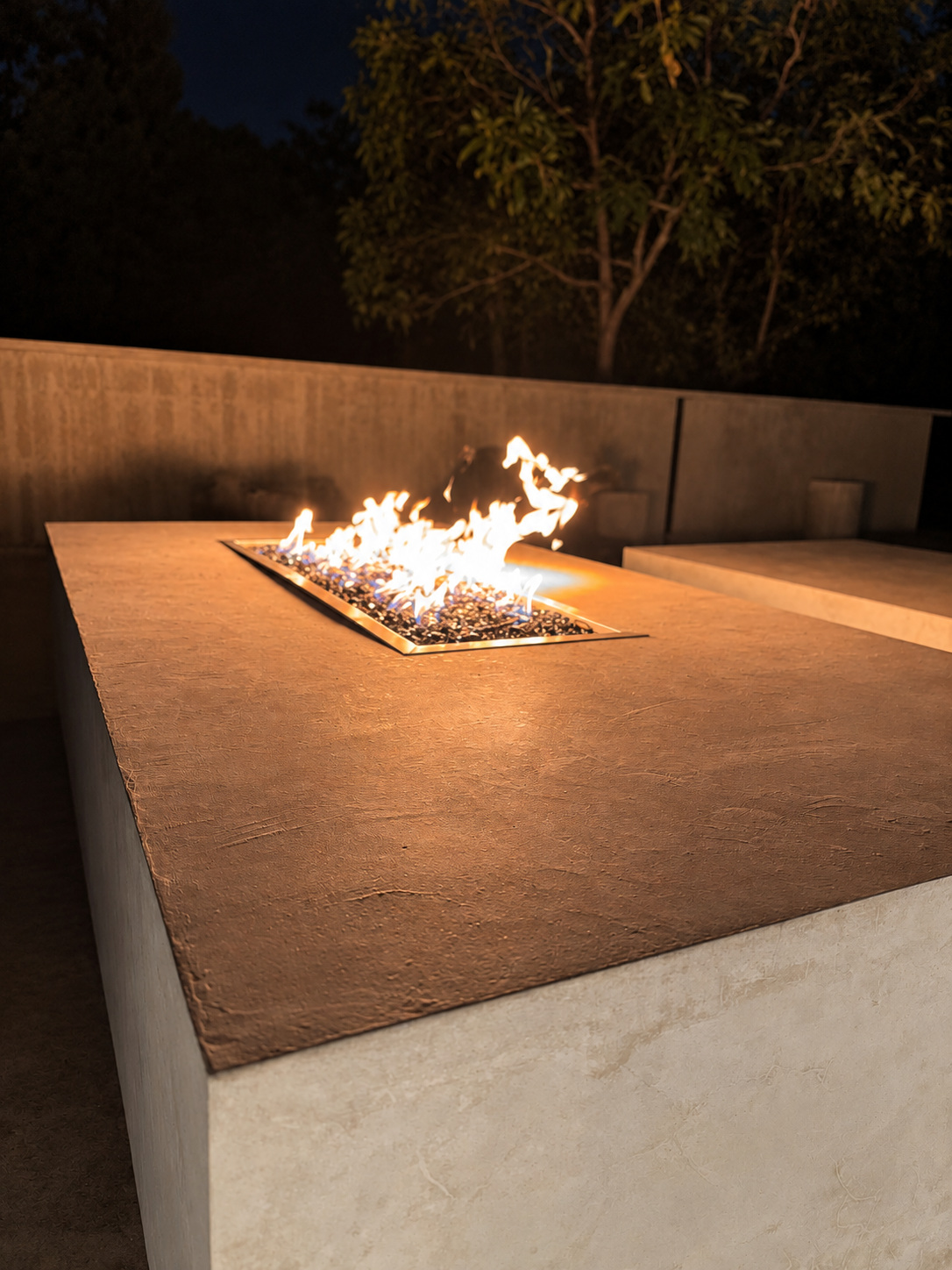 Rooftop gas fireplace lit at night